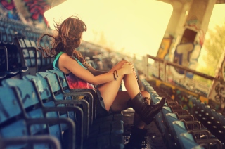 Картинка Girl Sitting In Stadium для андроид