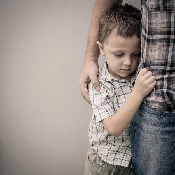 Sad son hugging his dad — стоковое фото