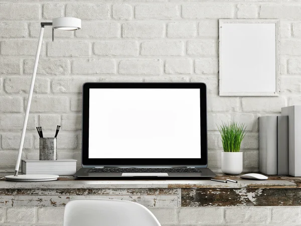 Laptop on wooden table, white brick wall — стоковое фото