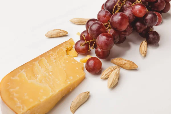 Closeup Shot Parmesan Cheese Almond Grapes White — стоковое фото