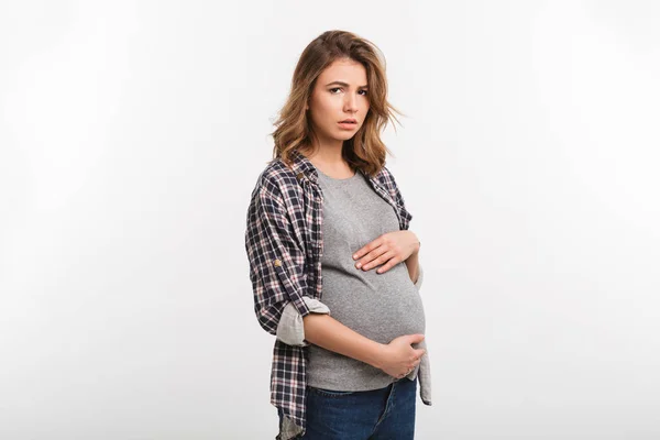 Sad pregnant woman — стоковое фото