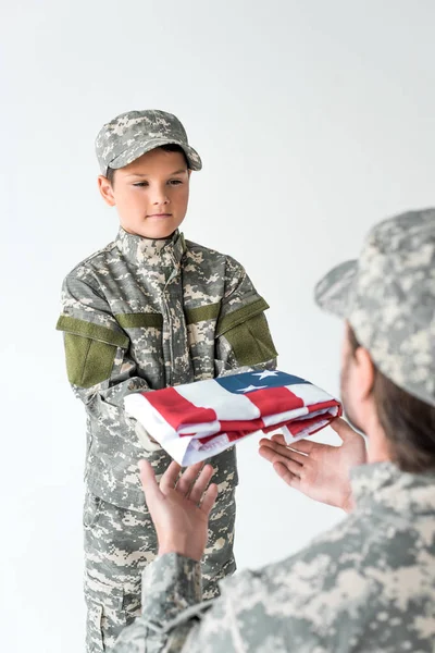 Partial View Little Boy Camouflage Clothing Giving Folded American Flag — стоковое фото