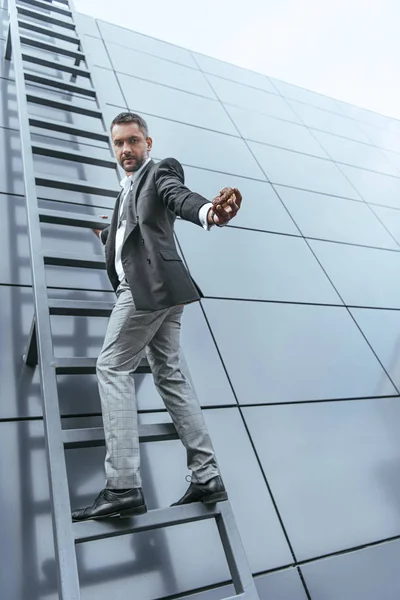 Low Angle View Man Fashionable Suit Holding Sweet Chocolate Donut — стоковое фото