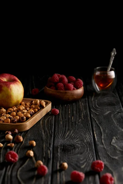 Hazelnuts Apple Raspberries Black Wooden Table — стоковое фото