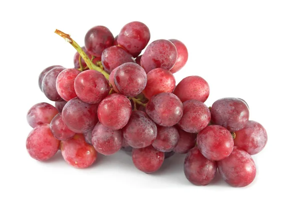 Красный виноград на белом — стоковое фото