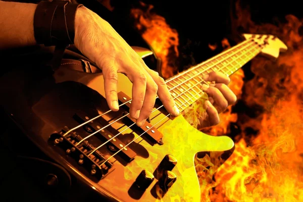 Guitar playing in fire — стоковое фото
